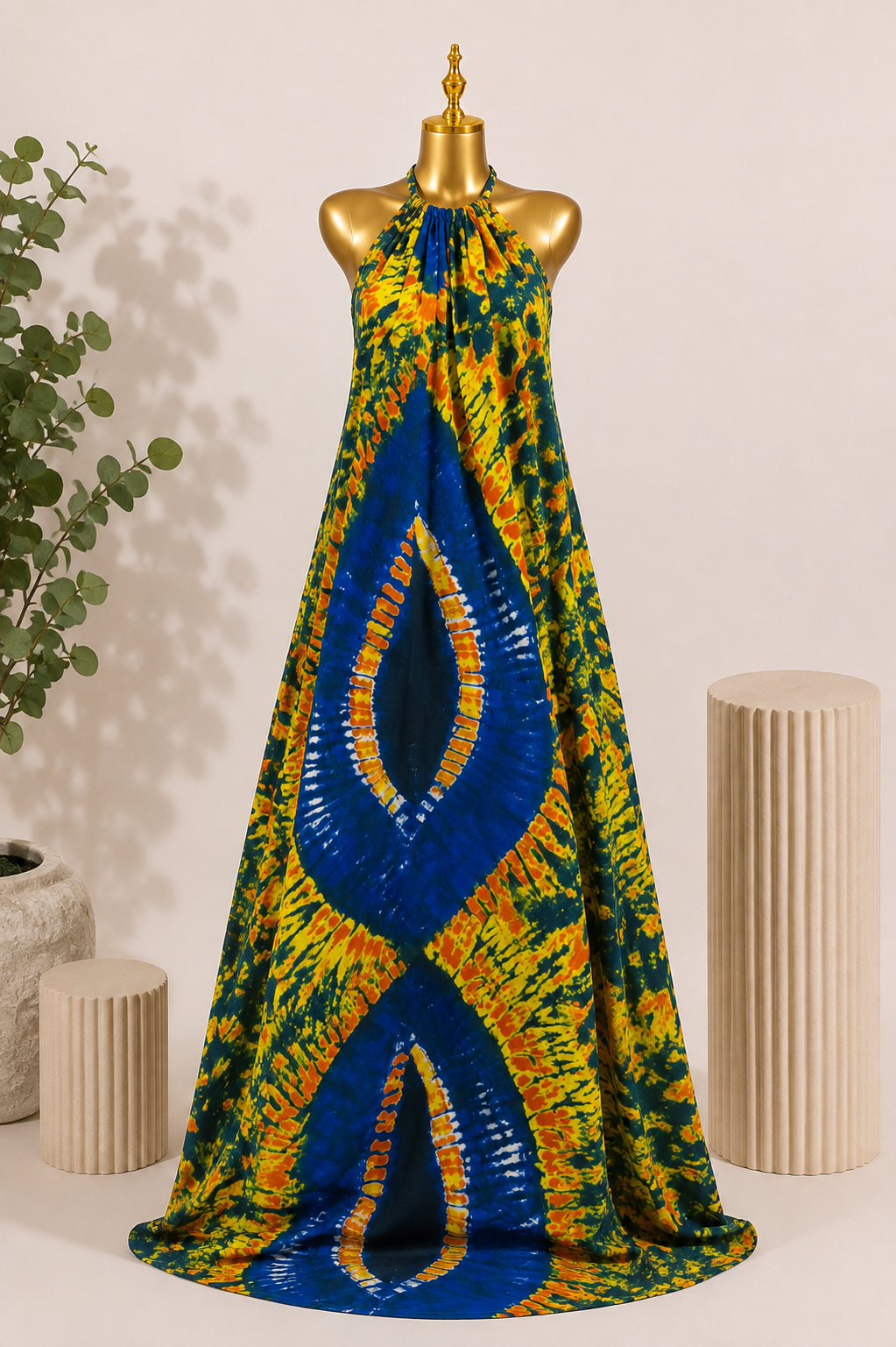 KAIOU Yemoja Maxi Dress, Adire-inspired halter-neck maxi dress in cobalt blue, yellow, orange and green — product image 1